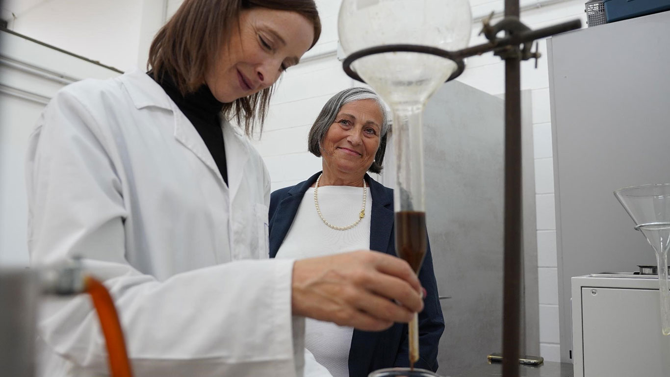 two women in a distillery lab