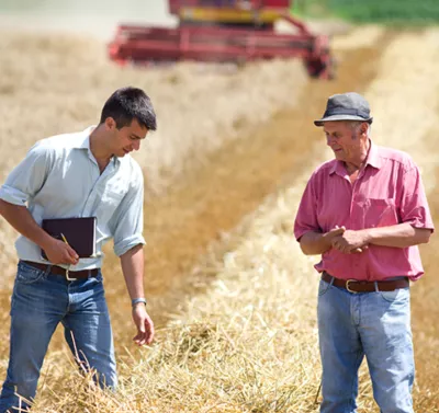 Two men talking on a field