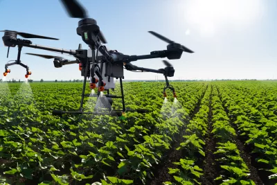 Drone flying over a cultivated field