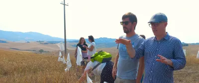 People discussing in a field