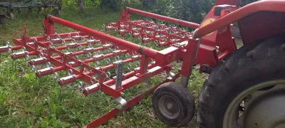 A tractor with a mounted mower.