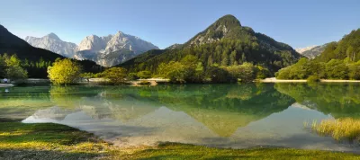 Scenic photo of a mountain and a lake in Slovenia