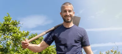 Young farmer smiling and happy