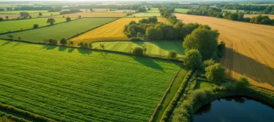 Aerial view of a regenerative farm featuring diverse crop rotation patterns