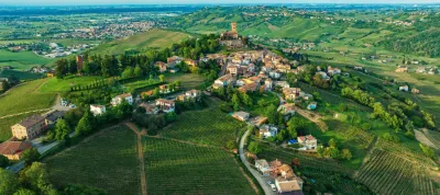 Ancient castle in the town of Cigognola, a view of town from a height. Drone photo