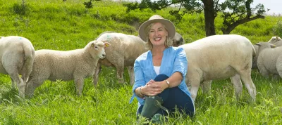 ARIA 2024 brochure cover image smiling woman with sheep