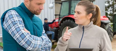 Farmers looking at a laptop