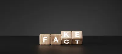 Flipping Wooden cube block for change fake to fact , news and social media concept