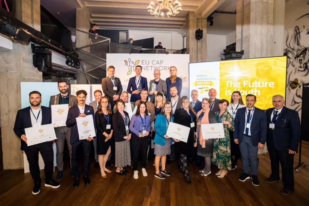 A group of people holding signs at the 'Rural Inspiration Award Winners 2022'