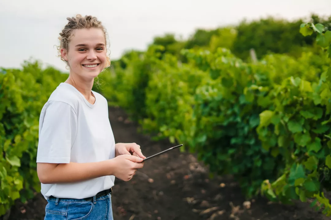 A woman standing in front of a plantation