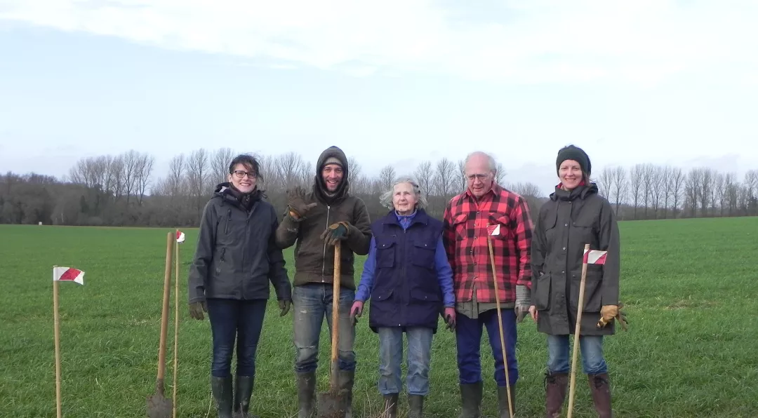 People smiling on a field