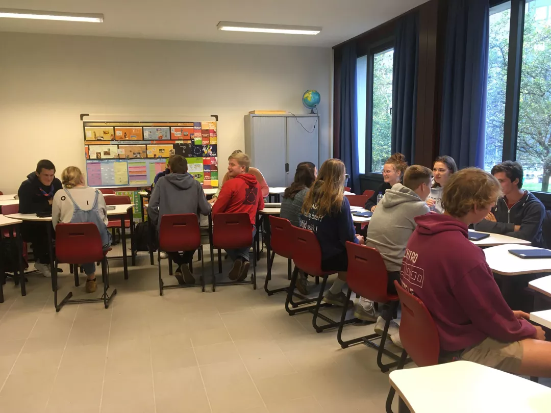 Group of teenagers sitting in class 