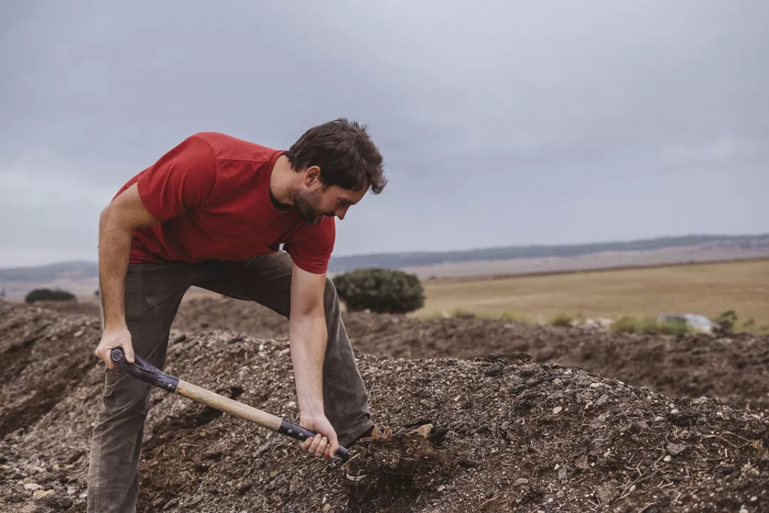 man working with land 