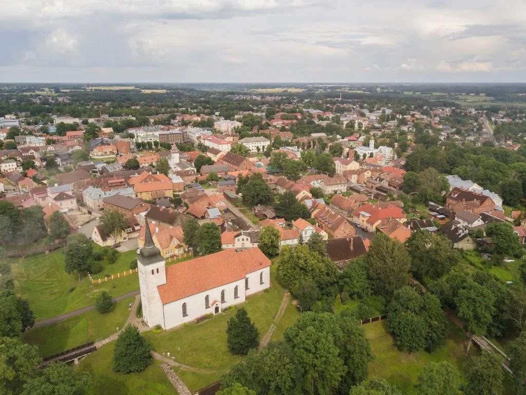 Aerial view of a town with colorful houses and a church