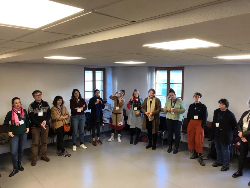 a group of people standing in a room