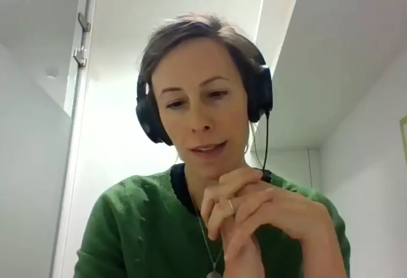 a woman wearing headphones during an online meeting for the "Thematic Group on Strengthening the position of farmers in the organic food supply chain"