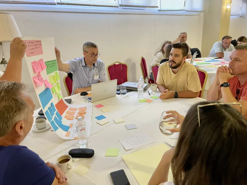 participants looking at post its