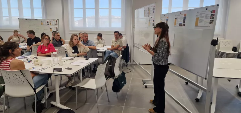 Participants listening to a presentation