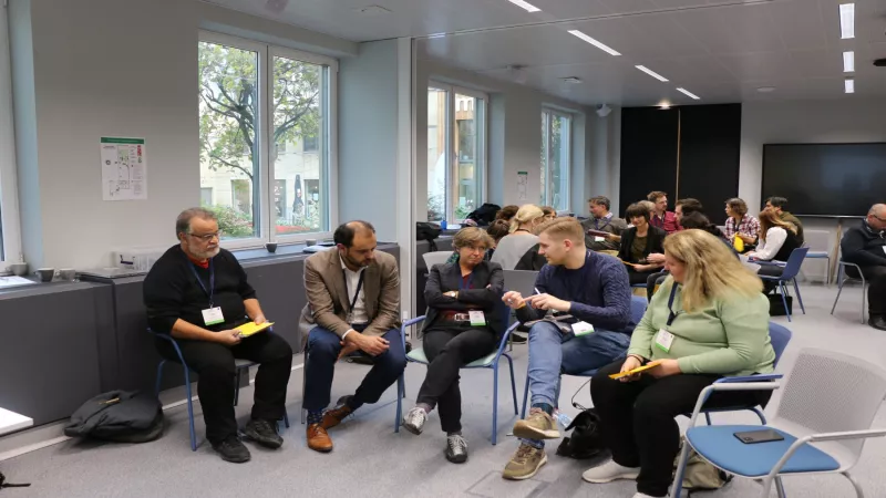 Participants in breakout groups discussing biodiversity