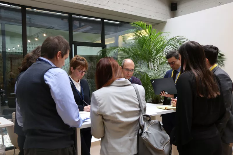 Participants gather in the atrium at the FSDN Workshop