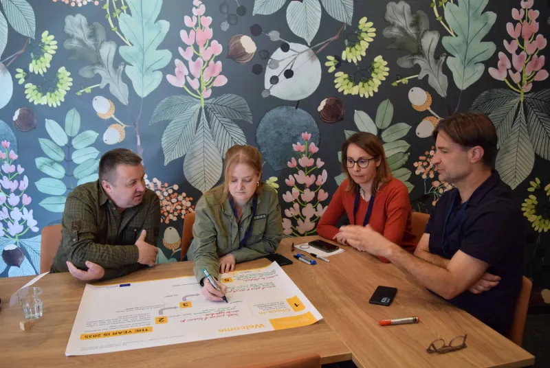 Participants writing during an interactive session