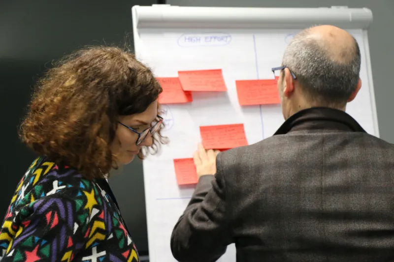 Woman and man presenting their ideas