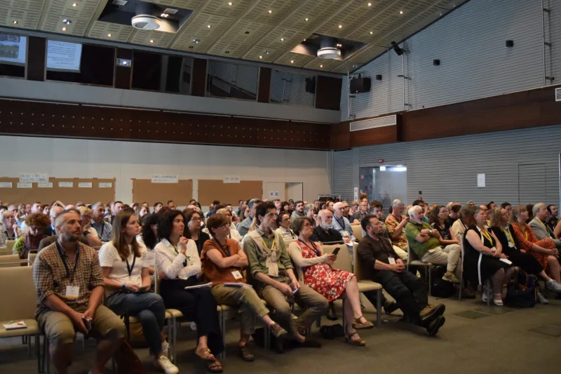 People sitting at conference in plenary