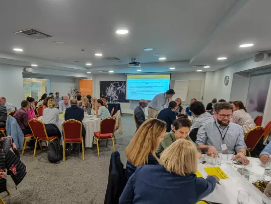 a group of people sitting around  tables in a room at the workshop on "How to assess direct payment interventions in the new CAP"