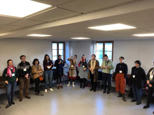 a group of people standing in a room