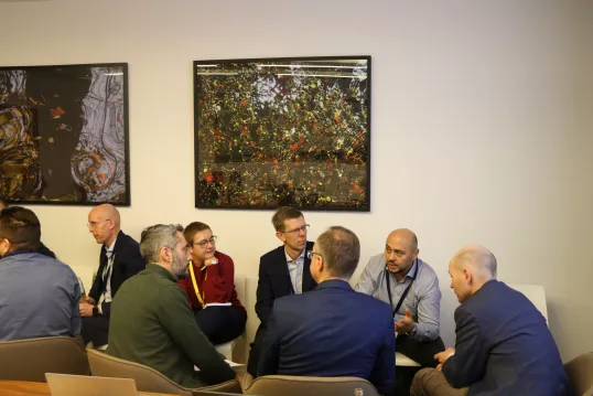 Participants in a circle discussing at the FSDN Workshop