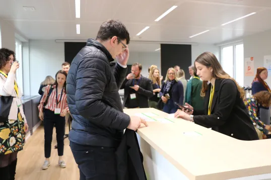 Man at registration point of event