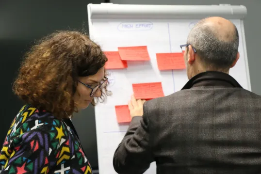 Woman and man presenting their ideas