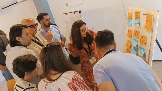 Participants at 2nd meeting of Focus Group 'Local perennial plant genetic resources in view of climate change and biodiversity loss' looking at the board
