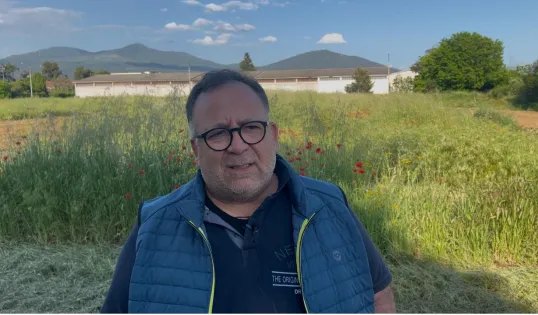 Man in front of field
