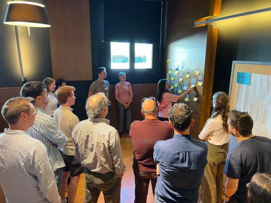 Group looking at wall of collaboration