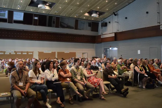 People sitting at conference in plenary