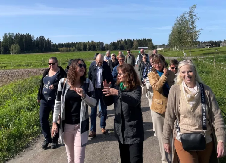 A group of people walking together in a field